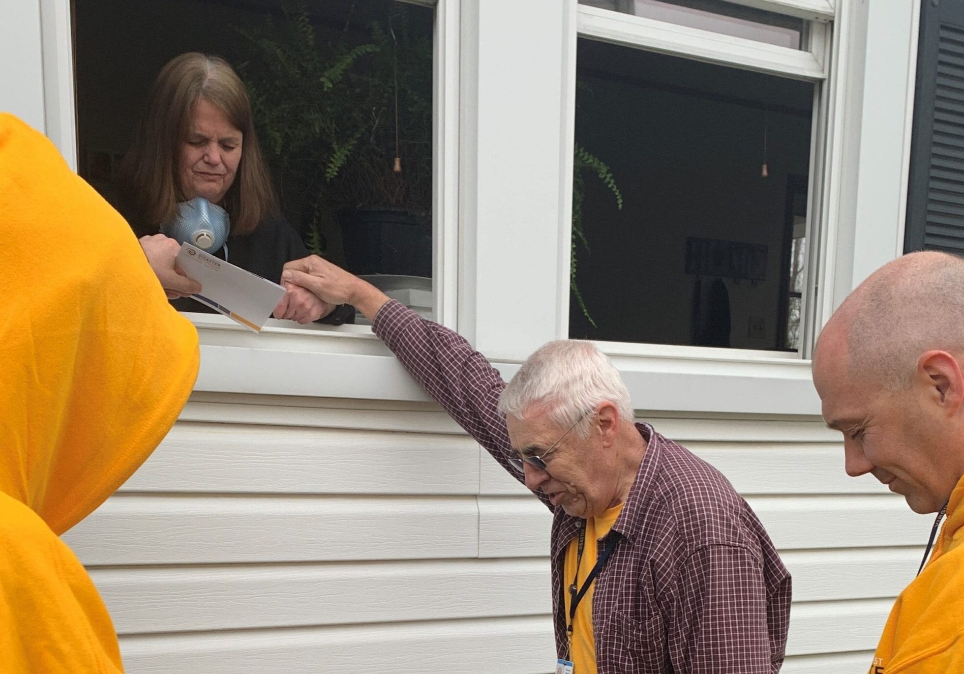 DR Praying With Homeowner2