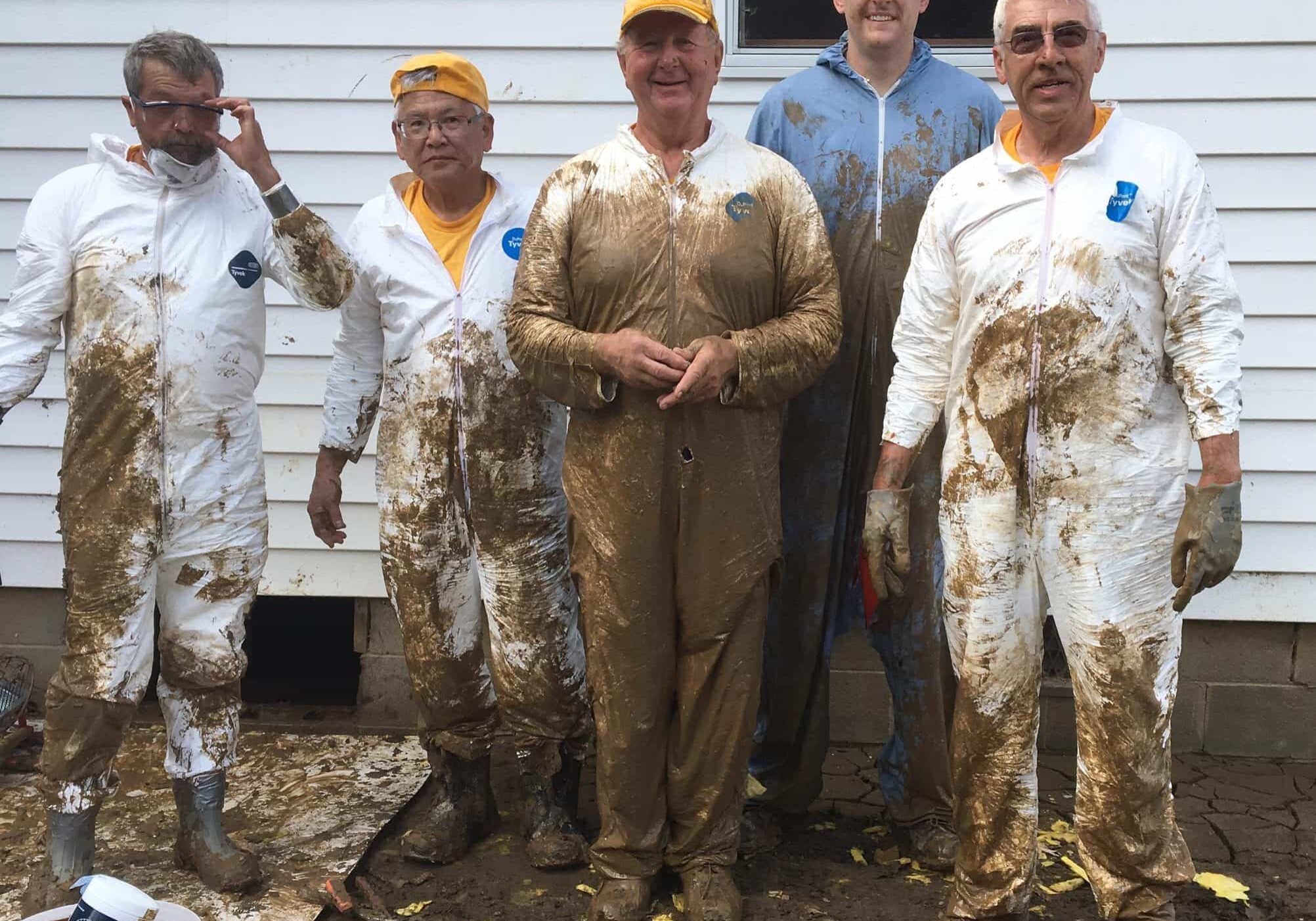 George (right) and his team accomplished some dirty work in West Virginia after the 2016 floods.